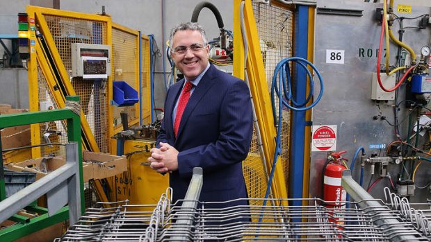 Shadow Treasurer Joe Hockey tours the manufacturing facility during a campaign visit to Multi Slide Industries.