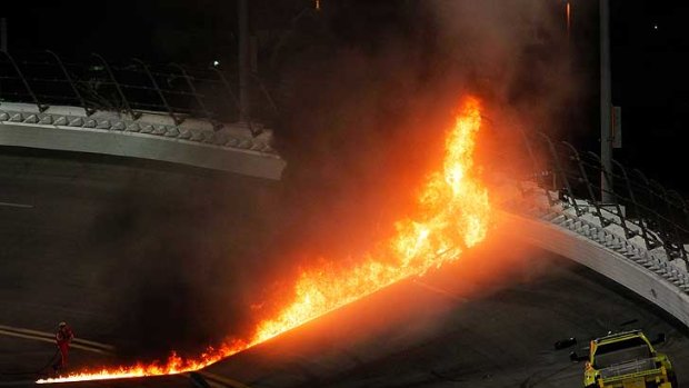 A jet dryer bursts into flames after being hit by Juan Pablo Montoya.