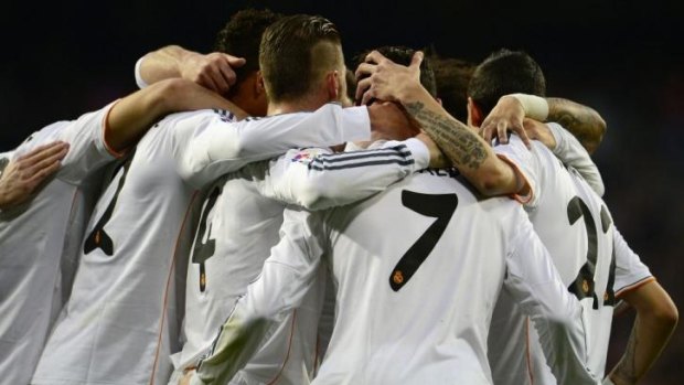 Real Madrid players celebrate after scoring during the Spanish league football match Real Madrid CF vs Levante UD at the Santiago Bernabeu stadium in Madrid.