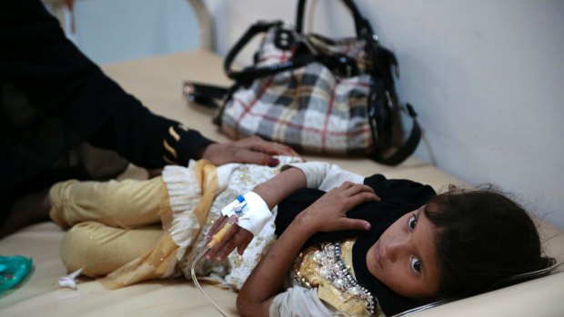 A girl is treated for a suspected cholera infection at a hospital in Sanaa, Yemen. 