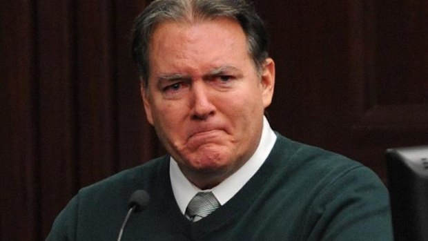 Defendant Michael Dunn reacts on the stand while giving testimony in his murder trial in Jacksonville, Florida.