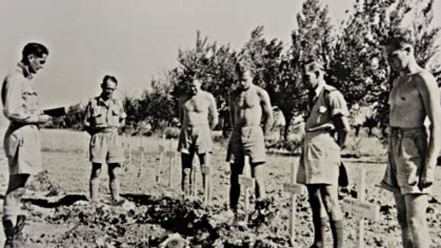 Ashes to ashes ... air force chaplain Fred McKay at a funeral for pilots in Italy in 1945.