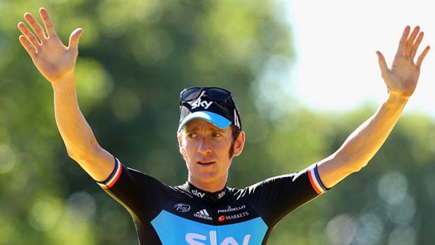 Bradley Wiggins celebrates winning the 2012 Tour de France. He will not defend his title this year.