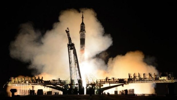 Lift off: The Russian Soyuz rocket blasts off from a launch pad at the Russian-leased Baikonur cosmodrome in Kazakhstan.