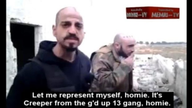 Two Los Angeles gang members apparently in a bombed out building in Syria. 