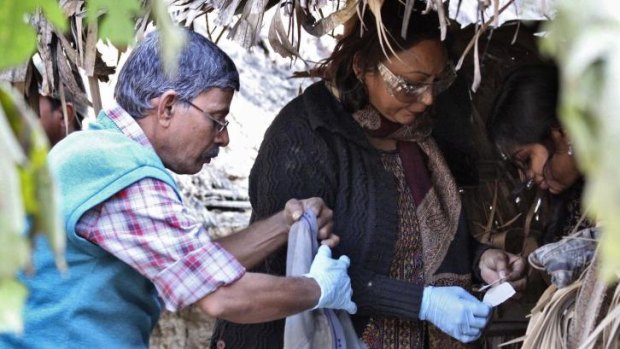 Forensic experts collect samples from an area where a woman was gang-raped at Birbhum district in the eastern Indian state of West Bengal.