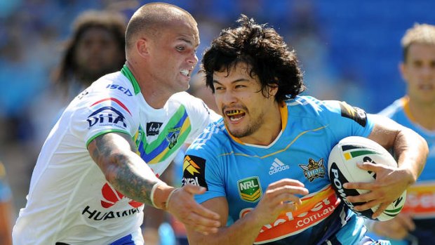 Kevin Gordon of the Titans is tackled during the round two NRL match between the Gold Coast Titans and the Canberra Raiders at Skilled Park.