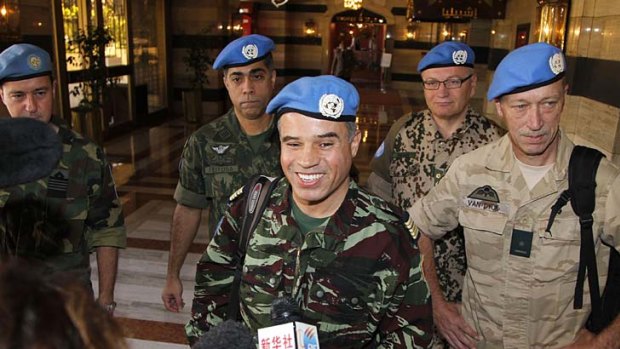 Colonel Ahmed Hommich, a member of a UN monitoring team, speaks to the media at a hotel in Damascus yesterday.