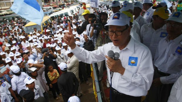 Hero's welcome: Sam Rainsy was mobbed by supporters when he returned to the country last week.