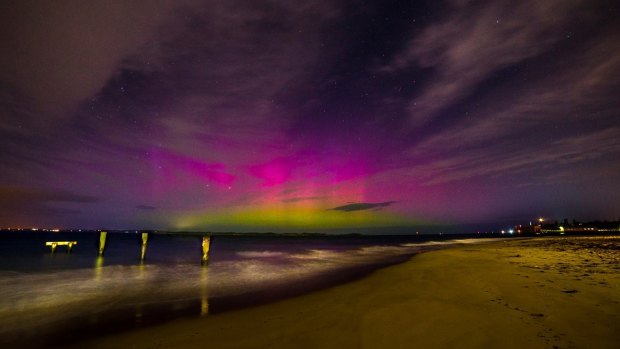 The aurora australis seen from behind the Queenscliff ferry terminal.