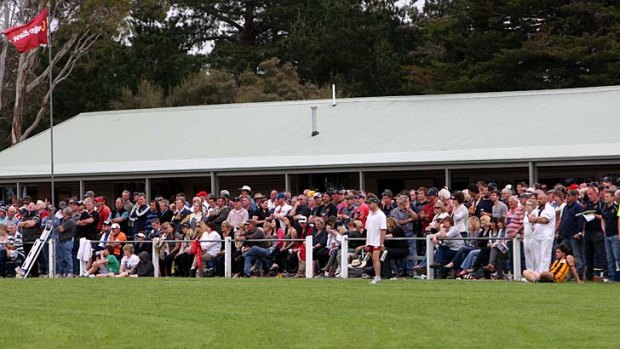 Field of dreams: The crowd lines the fence on grand final day at Mininera oval.