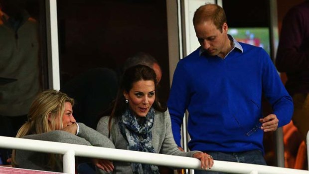 The Duke and Duchess take their seats in a private box for the game.