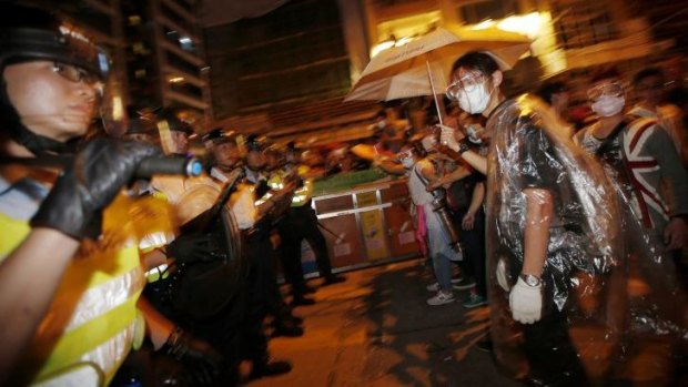 Face to face: Police confront pro-democracy protesters.