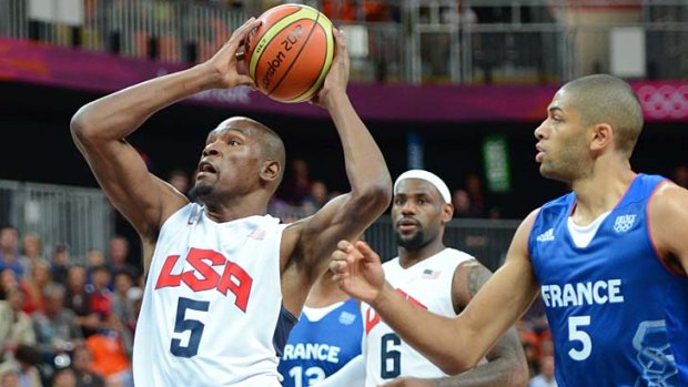Stars shine ... Kevin Durant drives to the hoop as LeBron James looks on.