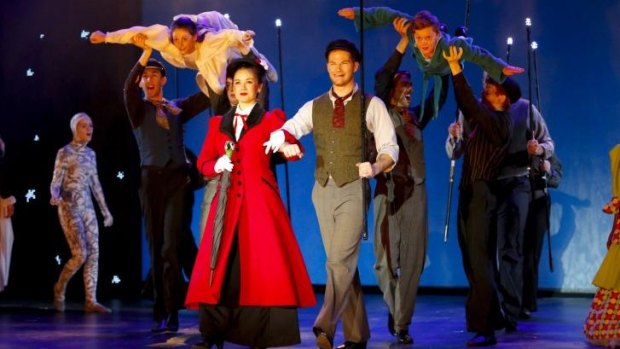 "Mary Poppins" - centre, Alinta Chidzey (in red) as Mary Poppins and Shaun Rennie (next to her) as Bert. Credit: Family Fotographics.