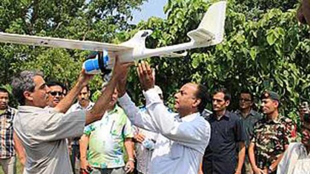 For conservation ... Serge Wich, one of the developers of the Drone, explaining the Drone's features to Hon. Minister of Forests and Soil Conservation, Yadu Bansa Jha.