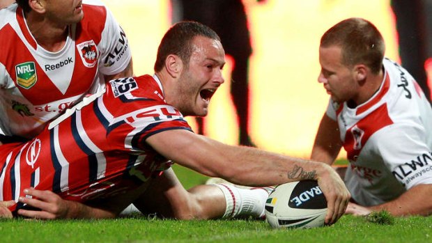 Rout: Boyd Cordner crosses the line for one of his side's six tries against the Dragons.