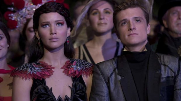 Jennifer Lawrence as Katniss and Josh Hutcherson as Peeta.