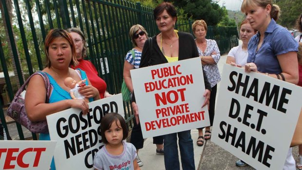 Future uncertain ... parents protest outside Henry Kendall High  School. Gosford Public School is to be amalgamated with it against the wishes of many.