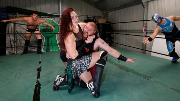 Power couple: Husband-and-wife team Ryan and Madison Eagles (centre) with fellow wrestlers Dan Wilson (left) and Blue Oni.