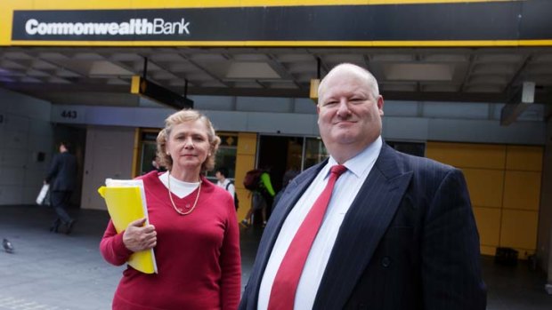 Merilyn Swan and Jeff Morris outside a Commonwealth Bank branch.