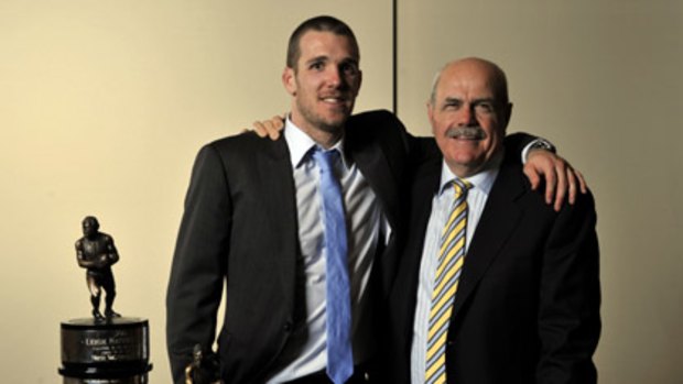 Dane Swan (left), the winner of the AFL Players Association's Most Valuable Player award, is congratulated by AFL legend Leigh Matthews, after whom the trophy is named.