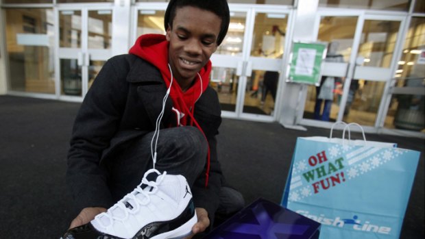 Kristopher Rush, 14, of Indianapolis, shows off the Nike Air Jordan shoes he got for Christmas from his parents.