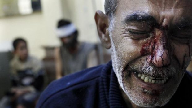 Nightmare of the Syrian people: a man mourns the death of his eight-year-old daughter in Aleppo in October 2012.