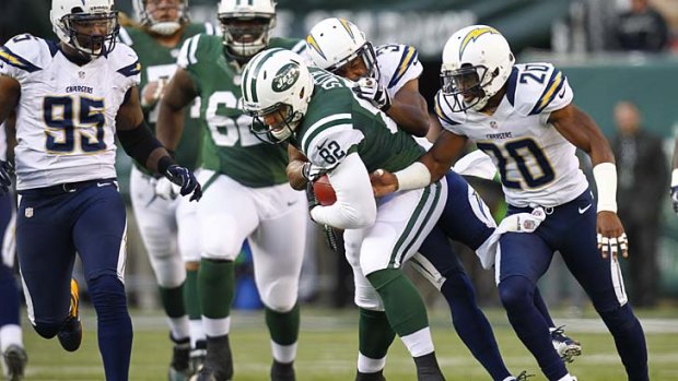 Hayden Smith (#82) charges forward for the New York Jets in the NFL.