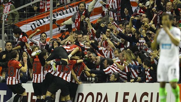 Athletic Bilbao's players celebrate at San Mames stadium.