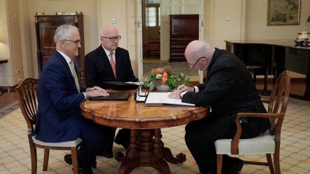 Prime Minister Malcolm Turnbull, Attorney-General George Brandis and Governor-General Sir Peter Cosgrove during a ceremony for the assent of the bill.