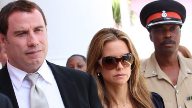 Extortion trial ... John Travolta and wife Kelly Preston leave court.
