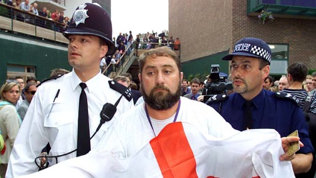Damir Dokic is led away by police at Wimbledon in 2000.