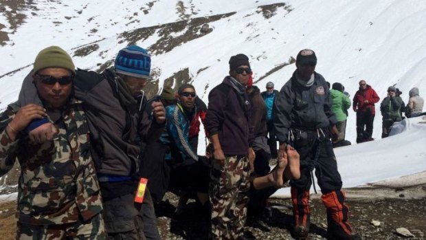 Saved: The Nepalese army helps survivors of the snowstorm.