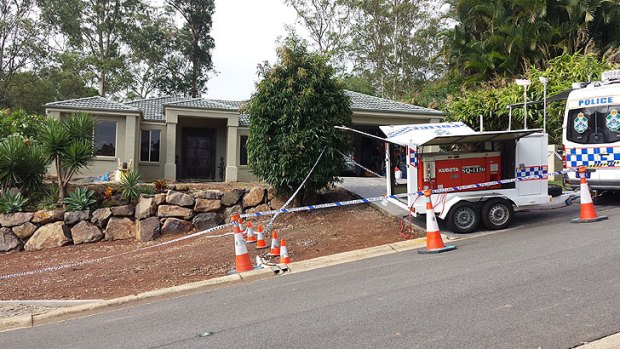 Police at a Gold Coast address where they are digging up a vehicle in their search for Novy Chardon.