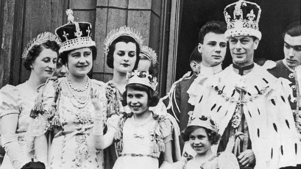 Family first ... Queen and daughters on the balcony at Buckingham Palace with King George VI after his coronation in 1937.