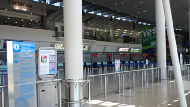 The terminal of Perth International Airport stands empty after a fire caused its evacuation.