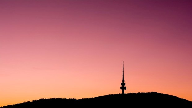 A image of a fiery sky as the sun sets over the Telstra Tower.