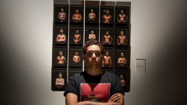 Tony Albert with <i>We Can Be Heroes 2013-14</i>, winner of the National Aboriginal and Torres Strait Islander Art Award.
