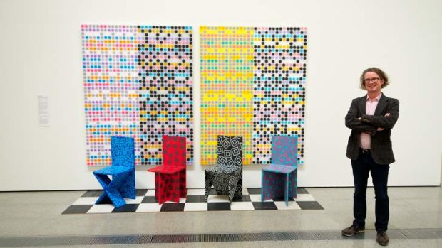Curator Max Delany and Howard Arkley's work <i>Muzak Mural Chair Tableau</i>, part of the Mix Tape exhibition.