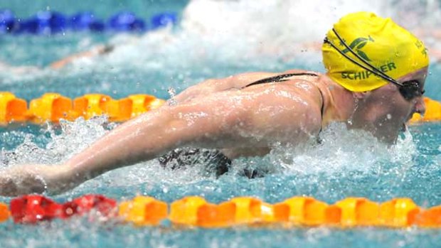 Golden girl . . . Jessicah Schipper held off Audrey Lacroix to win gold in the 200 metre butterfly. Fellow Australian Sam Hamill finished fourth