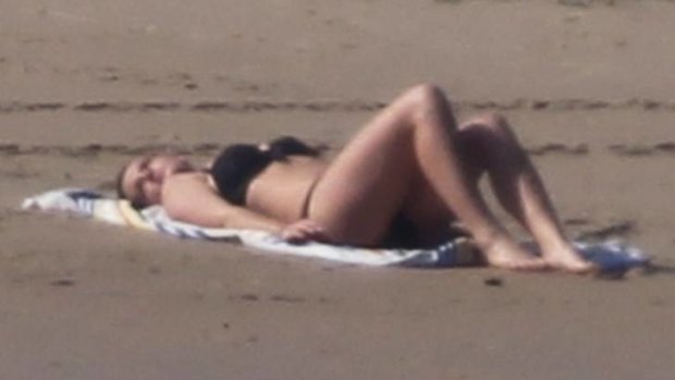 Gabriella Duddy poses on North Bondi to demonstrate how the paparazzi was able to snap the topless photo of Kate Middleton.