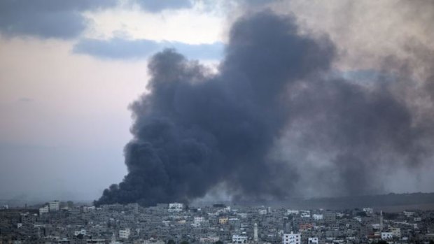  Smoke billows from a building hit by an Israeli air strike in Gaza City on Friday.