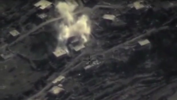 An air strike on a militant base in the province of Latakia, Syria, in an image taken from footage posted on the Russian defence ministry website. 