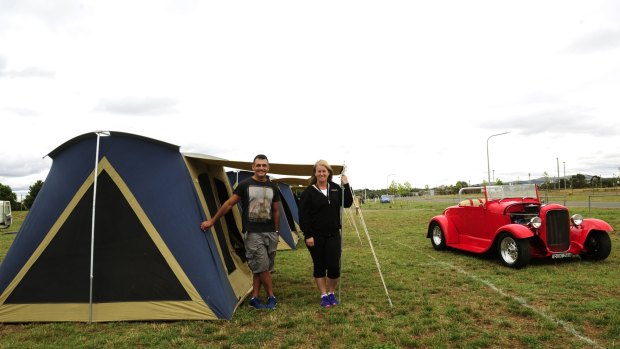 Summernats co-owner Andy Lopez and camping manager Tracy Kennedy at tent city with a 1928 Ford roadster for company.