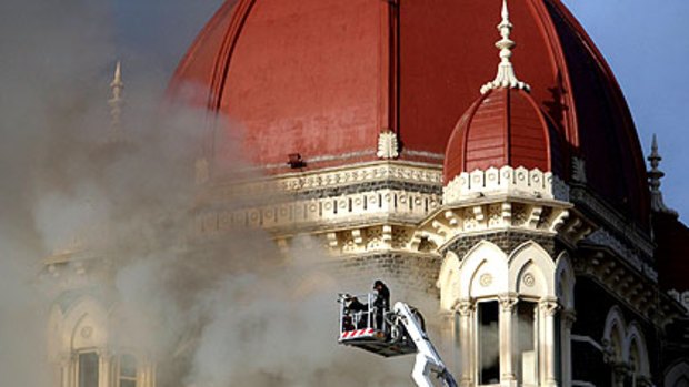 Firefighters try to douse a fire at the Taj Mahal Hotel in Mumbai.