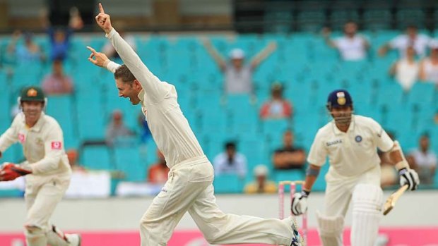 Australian skipper Michael Clarke celebrates after taking the prized wicket of Sachin Tendulkar at the SCG yesterday.