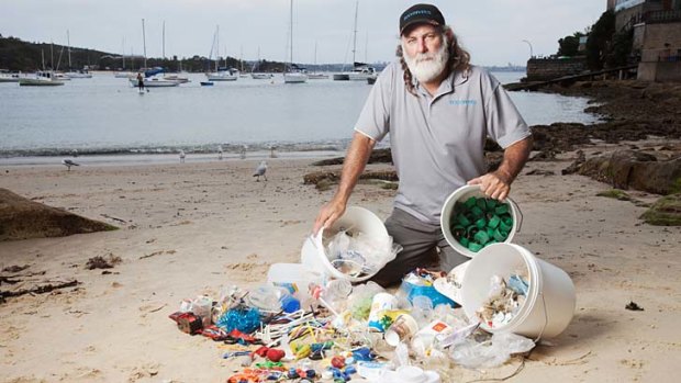 Debris haul &#8230; diver and conservationist Dave Thomas on Little Manly beach with rubbish he collected from Sydney's waterways over the holiday period.