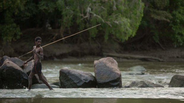 Wary: A Local fisherman fords the shallow water at Cahills Crossing on the East Alligator River.