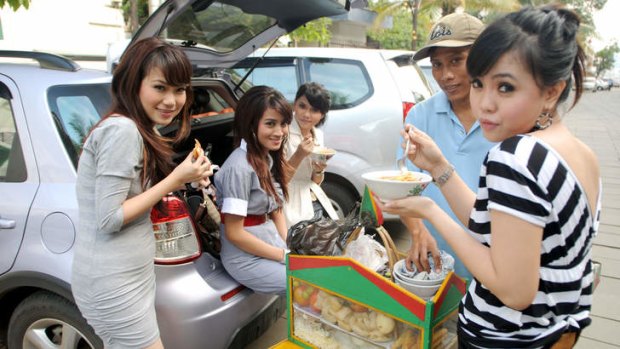 Locals snack on street food.